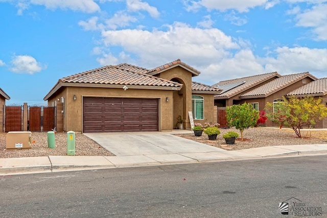 4272 W 27th Pl, Yuma, AZ 85364 - view of front of property featuring an attached garage, fence, a gate, and stucco siding