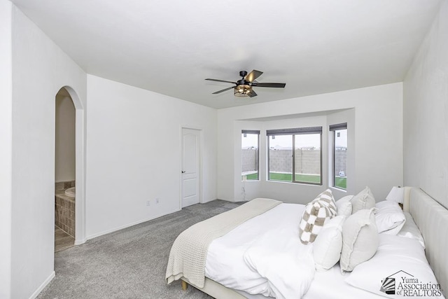 4272 W 27th Pl, Yuma, AZ 85364 - bedroom featuring carpet floors, arched walkways, ceiling fan, and baseboards
