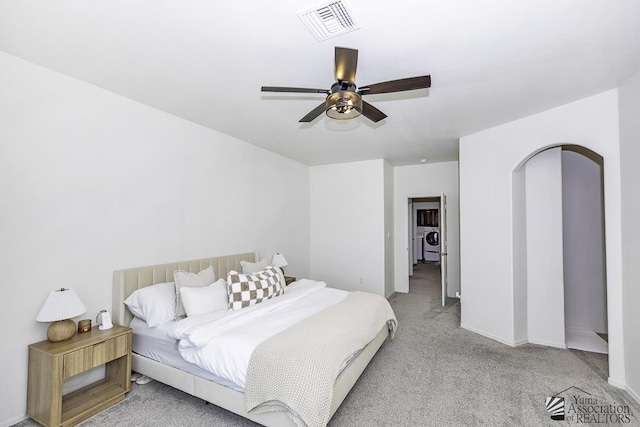 4272 W 27th Pl, Yuma, AZ 85364 - bedroom with light carpet, a ceiling fan, baseboards, washer / dryer, and visible vents
