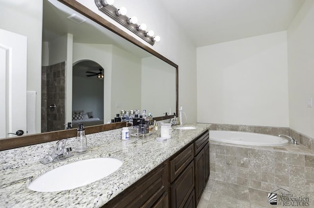 4272 W 27th Pl, Yuma, AZ 85364 - ensuite bathroom with a sink, a garden tub, a ceiling fan, and double vanity