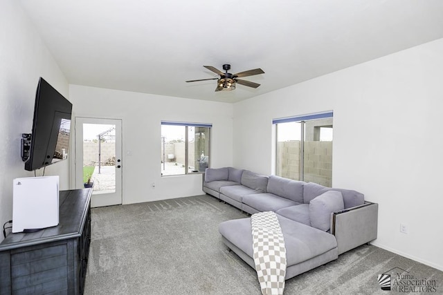 4272 W 27th Pl, Yuma, AZ 85364 - carpeted living room featuring a healthy amount of sunlight, baseboards, and a ceiling fan