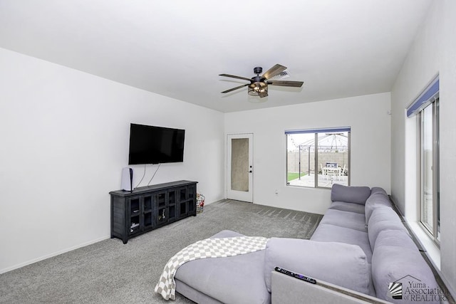 4272 W 27th Pl, Yuma, AZ 85364 - living room with carpet floors, baseboards, and ceiling fan