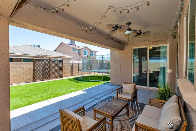 6588 E 35th Pl, Yuma, AZ 85365 - view of patio / terrace with a trampoline, a ceiling fan, and an outdoor hangout area