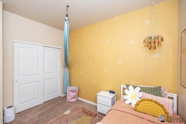 6588 E 35th Pl, Yuma, AZ 85365 - carpeted bedroom featuring a closet and baseboards