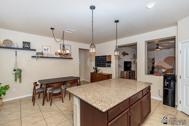 6588 E 35th Pl, Yuma, AZ 85365 - kitchen with light tile patterned flooring, a chandelier, decorative light fixtures, and ceiling fan