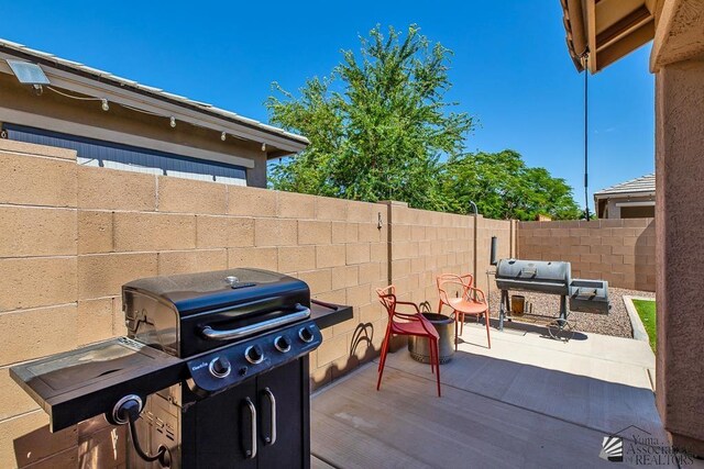 6588 E 35th Pl, Yuma, AZ 85365 - fenced backyard featuring a patio and area for grilling