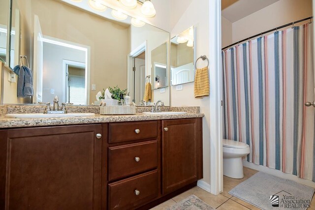 6588 E 35th Pl, Yuma, AZ 85365 - full bath with double vanity, tile patterned floors, and a shower with curtain
