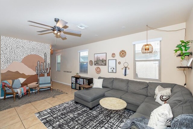 6588 E 35th Pl, Yuma, AZ 85365 - living room featuring light tile patterned flooring, ceiling fan, and a chandelier