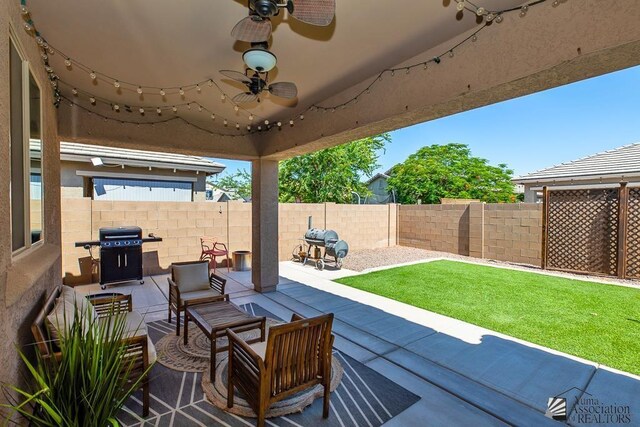 6588 E 35th Pl, Yuma, AZ 85365 - fenced backyard with grilling area, a patio area, and ceiling fan