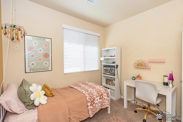6588 E 35th Pl, Yuma, AZ 85365 - carpeted bedroom with an office area