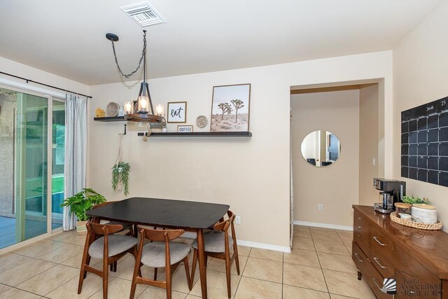 6588 E 35th Pl, Yuma, AZ 85365 - dining space featuring light tile patterned flooring and a chandelier