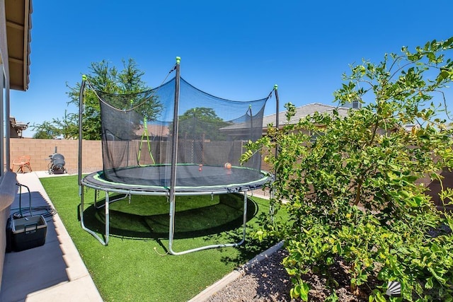 6588 E 35th Pl, Yuma, AZ 85365 - fenced backyard featuring a trampoline