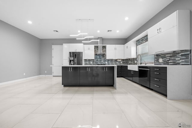 kitchen featuring a kitchen island, light countertops, white cabinets, stainless steel fridge with ice dispenser, and dishwasher