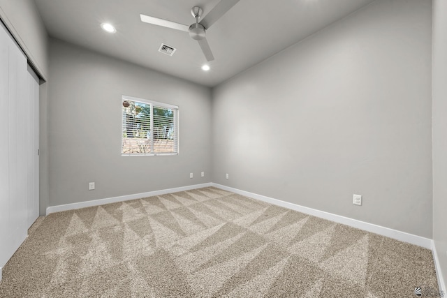 carpeted empty room featuring a ceiling fan, baseboards, visible vents, and recessed lighting