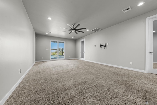 spare room featuring a ceiling fan, carpet flooring, recessed lighting, and visible vents