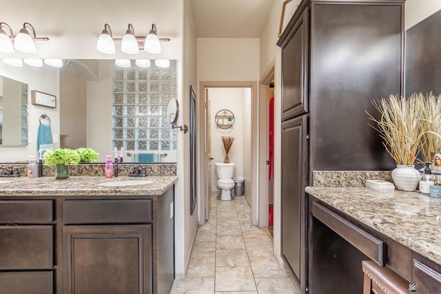 full bath with toilet and vanity