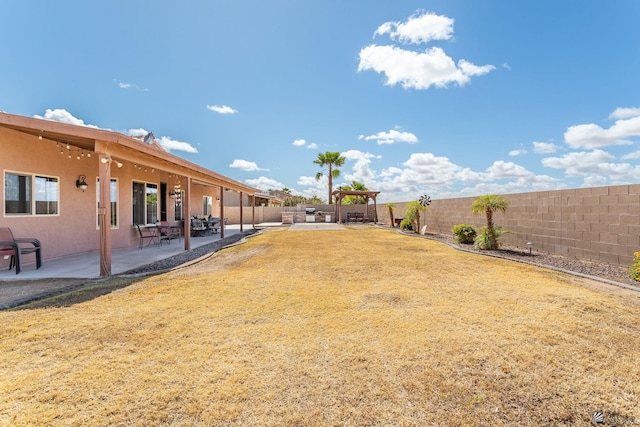 view of yard with a gazebo, a fenced backyard, and a patio area