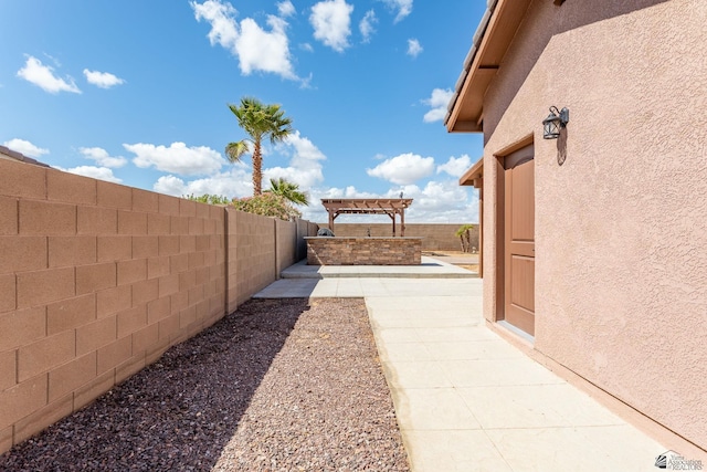 view of yard with a fenced backyard and a pergola