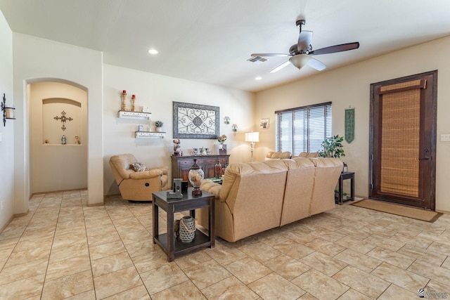 living room with recessed lighting, arched walkways, visible vents, and ceiling fan