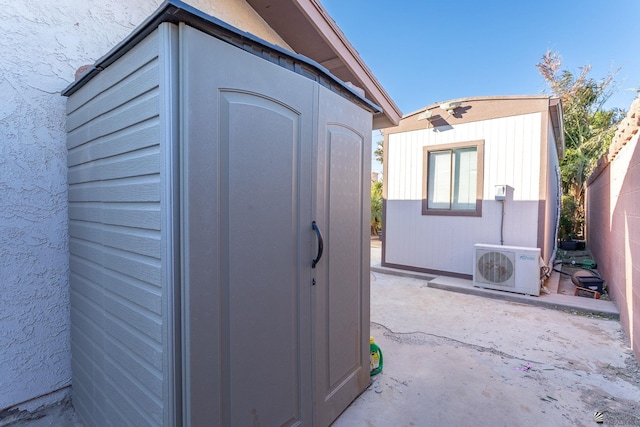 view of outbuilding featuring ac unit