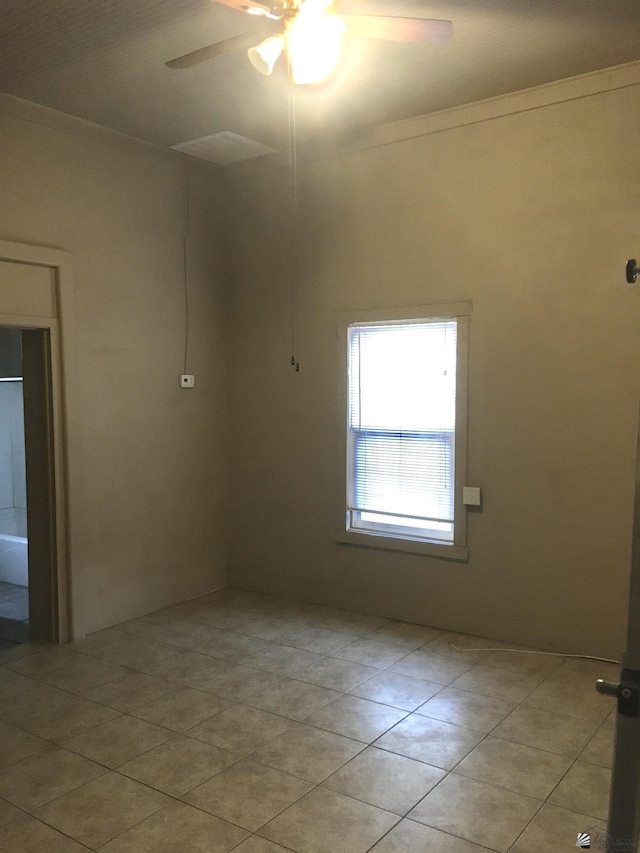 621 S Madison Ave, Yuma, AZ 85364 - unfurnished room with a ceiling fan, light tile patterned flooring, and crown molding