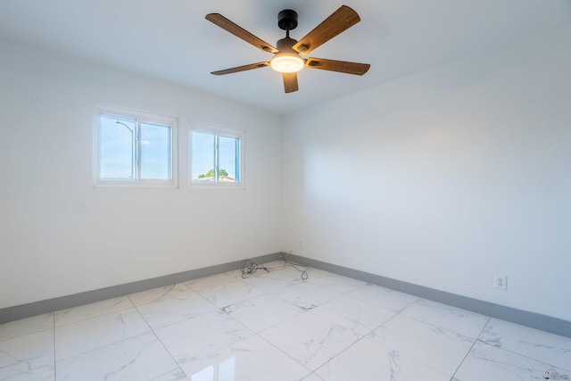 187 S San Clemente Dr, Yuma, AZ 85364 - empty room with baseboards, light marble finish flooring, and ceiling fan