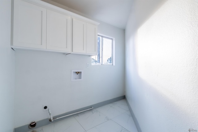 187 S San Clemente Dr, Yuma, AZ 85364 - washroom featuring cabinet space, light marble finish flooring, washer hookup, electric dryer hookup, and baseboards
