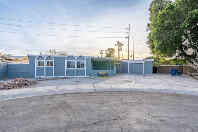 187 S San Clemente Dr, Yuma, AZ 85364 - view of front facade with concrete driveway, a garage, and stucco siding