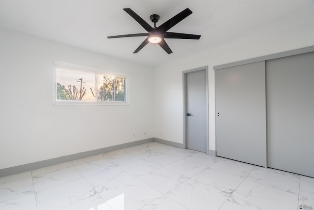 187 S San Clemente Dr, Yuma, AZ 85364 - unfurnished bedroom featuring light marble finish flooring, baseboards, and ceiling fan