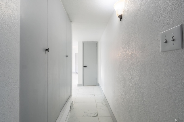 187 S San Clemente Dr, Yuma, AZ 85364 - hallway featuring light marble finish flooring and a textured wall