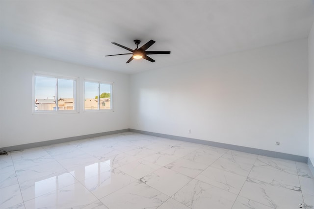 187 S San Clemente Dr, Yuma, AZ 85364 - unfurnished room featuring baseboards, ceiling fan, and light marble finish floors