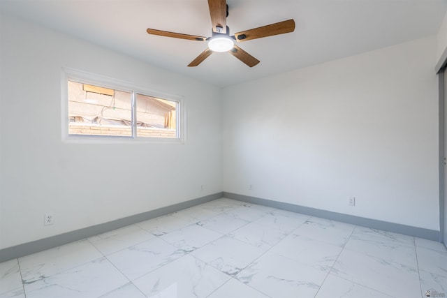 187 S San Clemente Dr, Yuma, AZ 85364 - empty room featuring baseboards, light marble finish floors, and ceiling fan