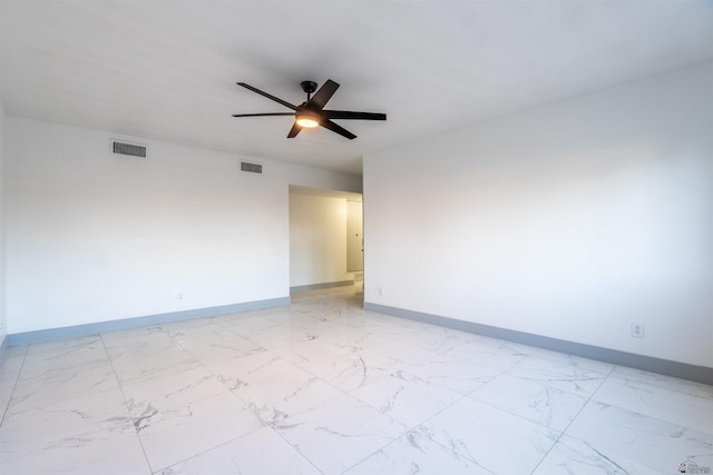 187 S San Clemente Dr, Yuma, AZ 85364 - spare room featuring light marble finish floors, baseboards, and ceiling fan
