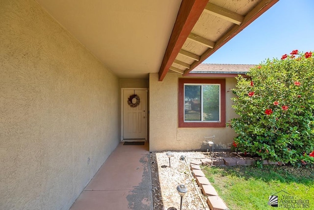 7442 E 24th Ln, Yuma, AZ 85365 - doorway to property featuring stucco siding