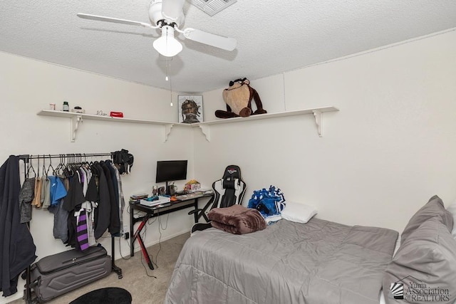 7442 E 24th Ln, Yuma, AZ 85365 - bedroom featuring light colored carpet, ceiling fan, and a textured ceiling