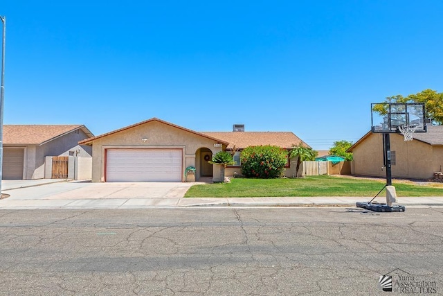 7442 E 24th Ln, Yuma, AZ 85365 - view of front of house featuring stucco siding, an attached garage, and driveway