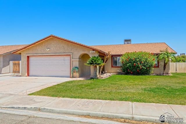 7442 E 24th Ln, Yuma, AZ 85365 - view of front facade with an attached garage, concrete driveway, and stucco siding