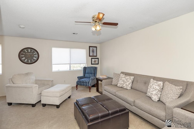 7442 E 24th Ln, Yuma, AZ 85365 - living area with light carpet and a ceiling fan
