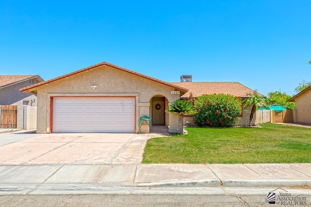 7442 E 24th Ln, Yuma, AZ 85365 - view of front facade featuring a garage, stucco siding, and driveway