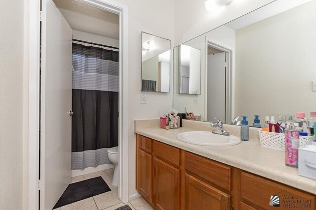 7442 E 24th Ln, Yuma, AZ 85365 - bathroom featuring toilet, tile patterned flooring, vanity, and a shower with curtain
