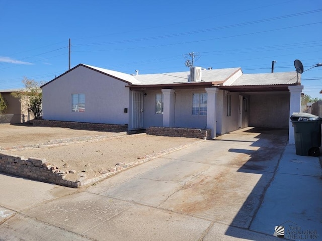 1429 S 12th Dr, Yuma, AZ 85364 - view of front of property with driveway, stucco siding, and an attached carport