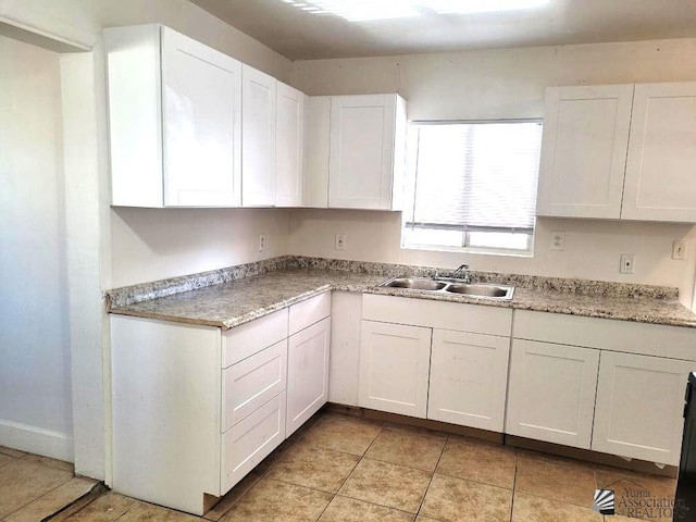 1429 S 12th Dr, Yuma, AZ 85364 - kitchen with a sink, white cabinetry, light countertops, and light tile patterned floors