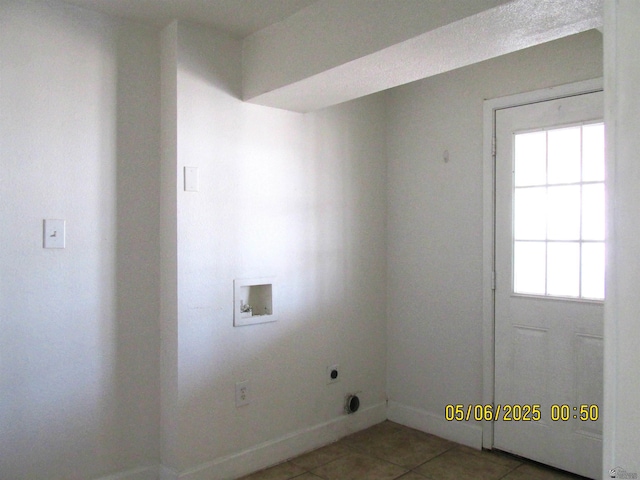1429 S 12th Dr, Yuma, AZ 85364 - laundry area featuring hookup for an electric dryer, washer hookup, light tile patterned floors, and healthy amount of natural light