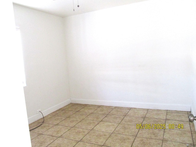 1429 S 12th Dr, Yuma, AZ 85364 - empty room with baseboards, ceiling fan, and light tile patterned floors