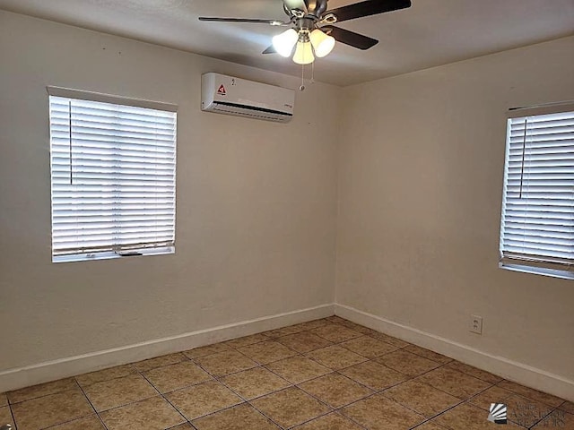 1429 S 12th Dr, Yuma, AZ 85364 - unfurnished room featuring a wall mounted air conditioner, baseboards, tile patterned floors, and ceiling fan