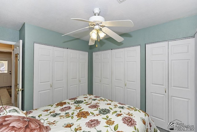 13734 E 47th Dr, Yuma, AZ 85367 - bedroom with a ceiling fan and two closets