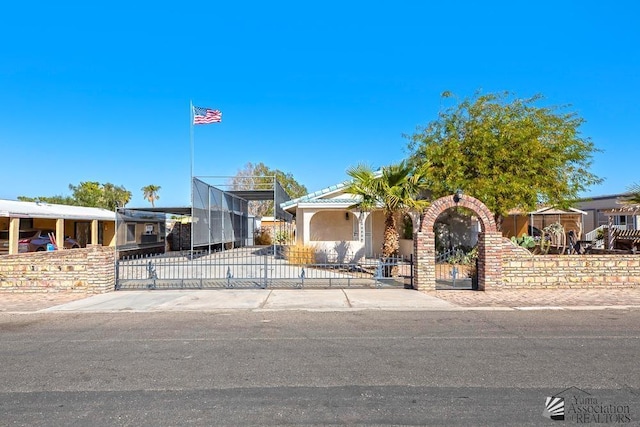 13734 E 47th Dr, Yuma, AZ 85367 - view of front facade with fence and a gate