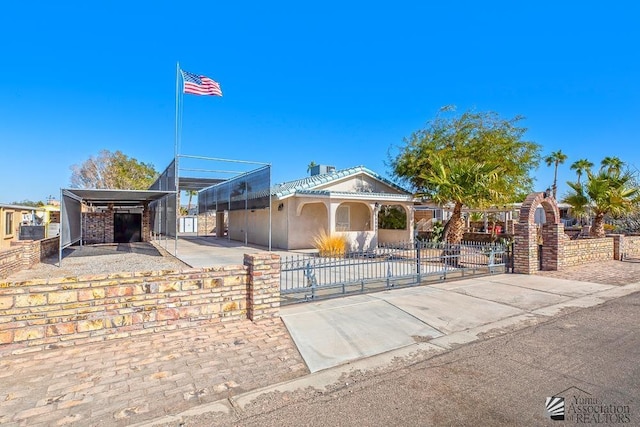 13734 E 47th Dr, Yuma, AZ 85367 - view of front of home featuring a gate, a carport, and a fenced front yard
