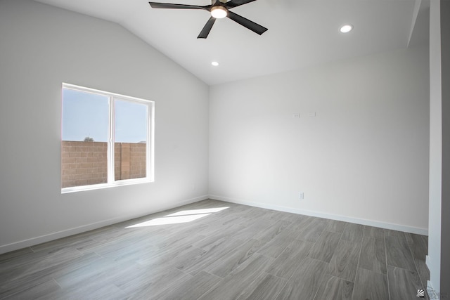 spare room featuring vaulted ceiling, recessed lighting, a ceiling fan, and light wood-type flooring