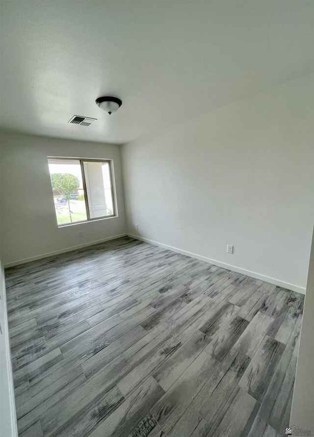 369 S 7th Ave, Yuma, AZ 85364 - empty room featuring wood finished floors and baseboards
